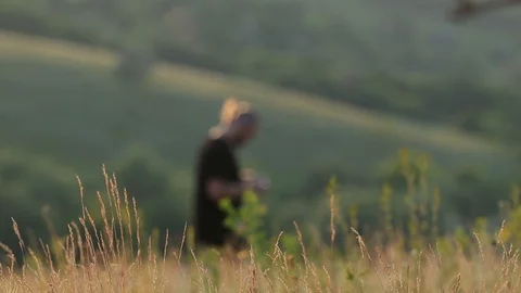 Young man Controlling Quadrocopter drone with Remote Control. Beautiful summe Stock Footage 110708149