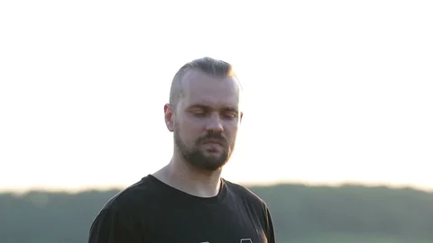 Young man Controlling Quadrocopter drone with Remote Control Stock Footage 110794605