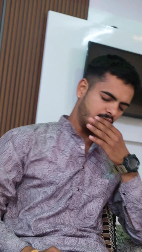 Young Man Coughing While Sitting Indoors – Health Problem, Cold or Flu Symptom 動画素材 330738447