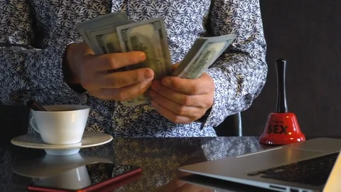 A young man counts dollars. Stock Footage 114381352