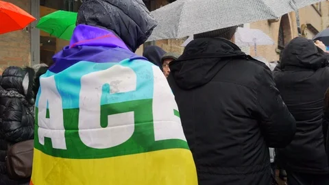  A young man covers himself with a peace flag  Stock Footage 102231686