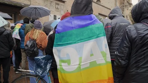  A young man covers himself with a peace flag  Stock Footage 102231696