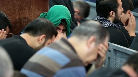 A young man cries while listening to Hussein's calamity, Beirut Stock Footage 119957253