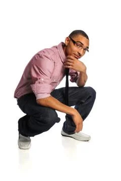 Young Man Crouching Stock Photos