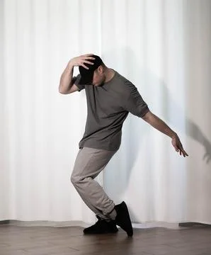 Young man in a dance pose Stock Photos