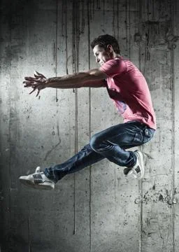 Young man dancer jumping Stock Photos