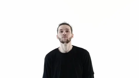 Young man dances freestyle in studio on white backgroun Stock Footage 275548461