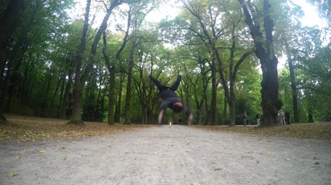 Young man dancing breakdance in the parks Stock Footage 55237187