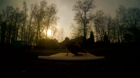 Young man dancing breakdance on the street at sunset Video stock 48682913