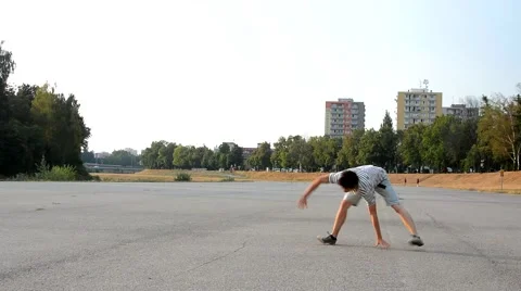 Young man dancing breakdance on the street Stock Footage 53235695