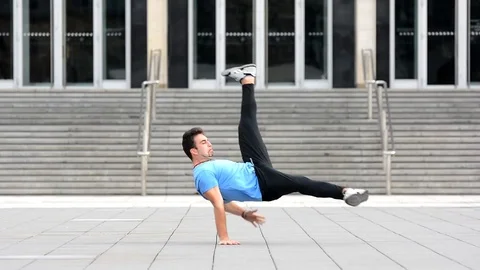 Young man dancing breakdance on the street. Stock Footage 73173887