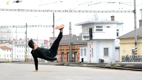 Young man dancing breakdance on the street. Video stock 73173899