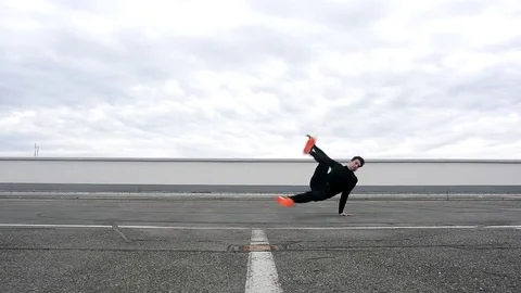 Young man dancing breakdance on the street. Stock Footage 73173904