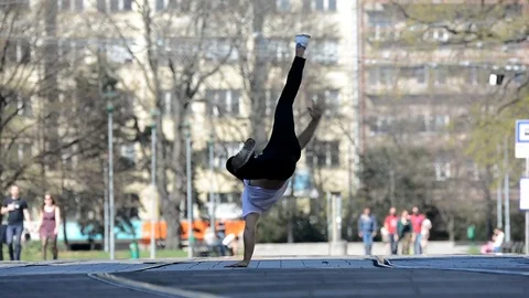 Young man dancing breakdance on the street. Stock Footage 74081307