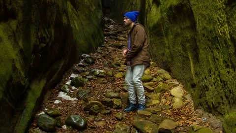 Young man dancing in the canyon Stock Footage 82545521