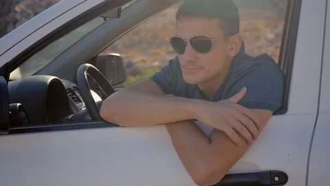 Young man dancing in a car Stock Footage 83309358