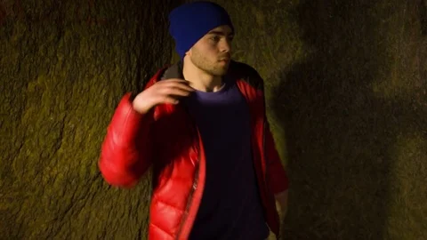 Young man dancing in the cave. Stock-Footage 82467493