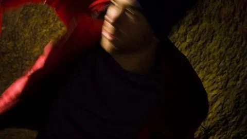 Young man dancing in the cave. 스톡 동영상 82487716