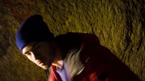 Young man dancing in the cave. 스톡 동영상 82488183