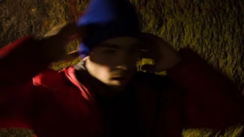 Young man dancing in the cave. Stock-Footage 82488853