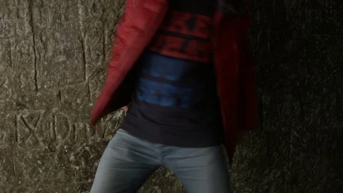 Young man dancing in the cave. Video stock 82587266