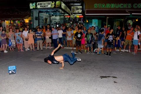 A young man dancing in front of the audience on Bangla Road. Stock Photos
