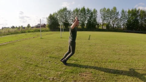 Young man dancing joyfully on a vibrant soccer field showcases energetic 스톡 동영상 283678966