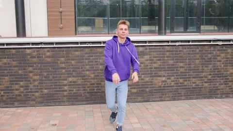 Young man dancing modern dance, hip hop on the city street Stock Footage 139758442