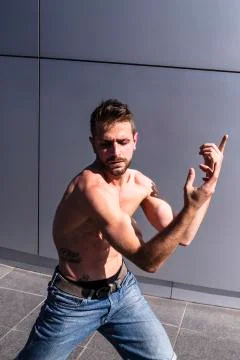 Young man dancing modern dance outdoor on street Stock Photos