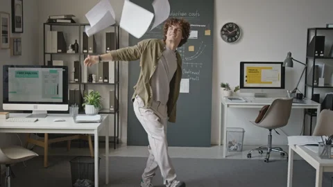 Young Man Dancing in Office and Throwing Paperwork Stock Footage 345242234