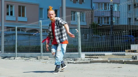 A young man is dancing outdoors Video stock 148084965