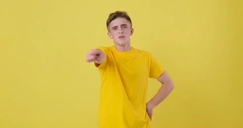 Young Man dancing over yellow background in slow motion Stock Footage 144956983