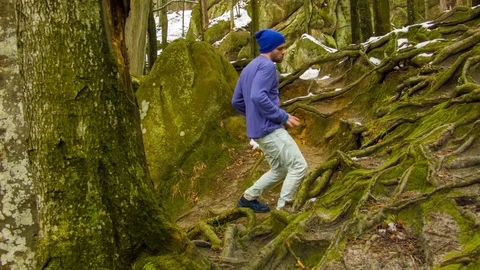 Young man dancing on a rock Stock Footage 82107688