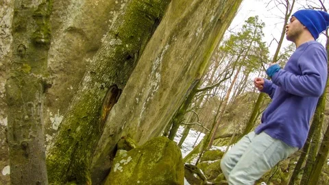 Young man dancing on a rock Stock-Footage 82384608