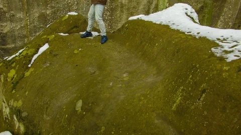 Young man dancing on a rock Stock Footage 82401607