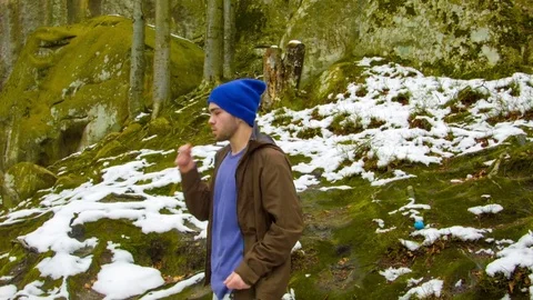 Young man dancing on a rock Stock-Footage 82500575