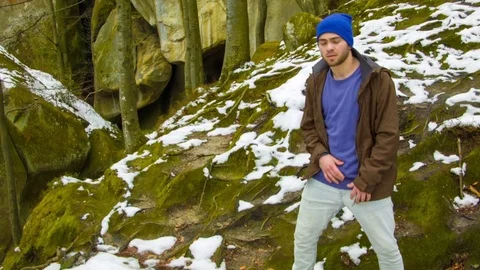 Young man dancing on a rock Stock-Footage 82504672