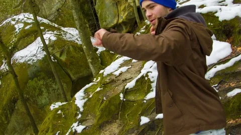 Young man dancing on a rock Stock Footage 82505990