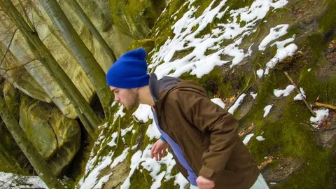 Young man dancing on a rock Stock-Footage 82509144