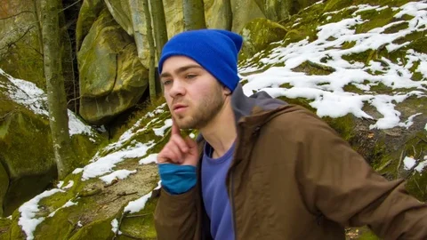Young man dancing on a rock Stock Footage 82509679