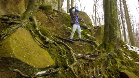 Young man dancing on a rock Stock-Footage 82522768