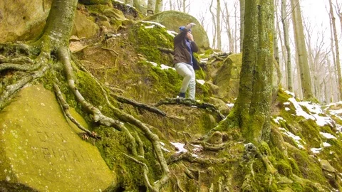 Young man dancing on a rock Stock Footage 82541909