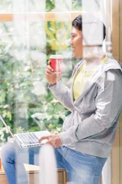 Young man day dreaming while drinking a coffee during break 스톡 사진