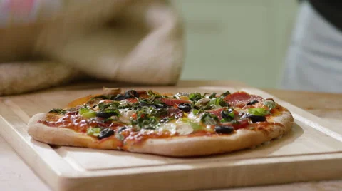 Young man decides to make home made Pizza for Dinner. Video stock 63024194