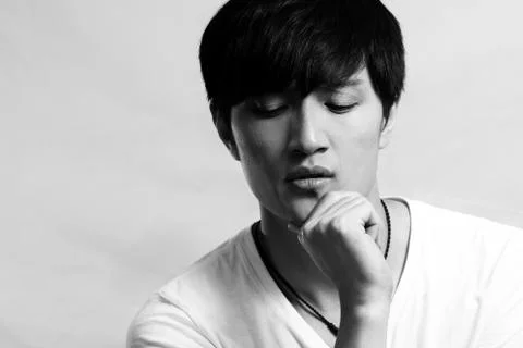 Young man deep in thought Stock Photos