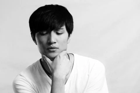Young man deep in thought Stock Photos