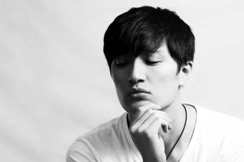 Young man deep in thought Stock Photos