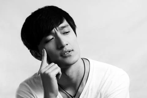 Young man deep in thought Stock Photos