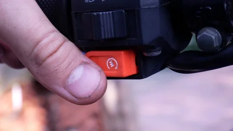 Young man demonstrates how to start a quad bike Stock Footage 113742830