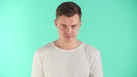 A young man demonstrates a transition from negative emotions to positive ones Stock Footage 251380752